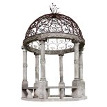 A carved limestone and wrought iron mounted garden gazebo, 20th century  A carved limestone and