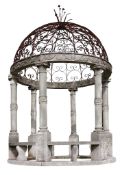 A carved limestone and wrought iron mounted garden gazebo, 20th century  A carved limestone and