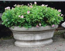 A French carved Bourgogne stone planter, 20th century, of oval section  A French carved Bourgogne