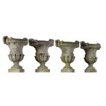 A set of four stone composition garden urns, first half 20th century   A set of four stone