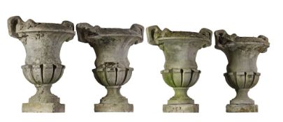 A set of four stone composition garden urns, first half 20th century   A set of four stone