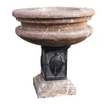 A carved rouge royale and black marble mounted planter A carved rouge royale and black marble