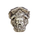 A carved marble wall fountain modelled as a Bacchic mask, 20th century  A carved marble wall
