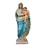 A polychrome painted terracotta group of the Madonna and Child  A polychrome painted terracotta