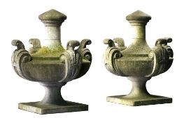 A pair of large Continental carved limestone urn finials, 20th century  A pair of large