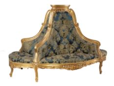 A Continental giltwood and composition and upholstered lobby sofa or  A Continental giltwood and
