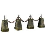 A set of four limestone and wrought iron mounted border stones, 19th century  A set of four
