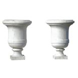 A pair of carved white marble garden urns, 19th century, each with knopped rim  A pair of carved