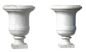 A pair of carved white marble garden urns, 19th century, each with knopped rim  A pair of carved