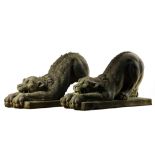 A pair of Continental sculpted limestone models of lions, 20th century  A pair of Continental