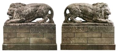 A pair of Continental sculpted limestone models of lions on plinths  A pair of Continental