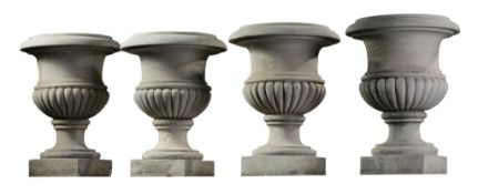 A set of four carved Carrara marble urns, 19th century, each with everted rim  A set of four