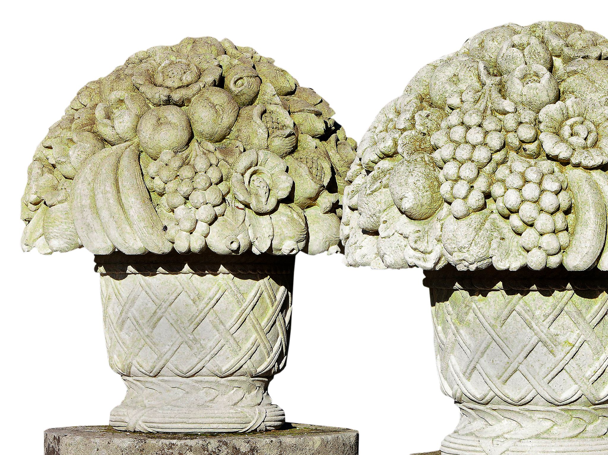 A pair of large Continental carved limestone baskets of flowers and fruit in...  A pair of large