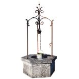An Italian carved Istrian stone and wrought iron mounted wellhead, 19th century An Italian carved