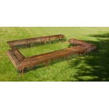 A set of five wrought iron garden benches constituting an open rectangular...  A set of five wrought