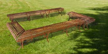 A set of five wrought iron garden benches constituting an open rectangular...  A set of five wrought