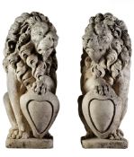 A pair of Continental sculpted limestone models of heraldic lions, 20th century  A pair of