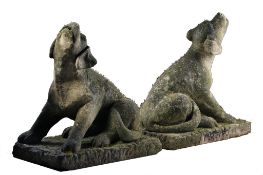 A pair of carved limestone models of howling dogs , second half 20th century  A pair of carved