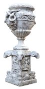 An Italian sculpted Carrara marble urn on pedestal, late 19th century  An Italian sculpted Carrara