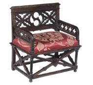 A Victorian Gothic Revival carved oak hall chair , circa 1880  A Victorian Gothic Revival carved oak