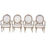 A set of four oval back painted open armchairs in Louis XVI style  A set of four oval back painted