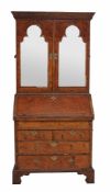 A George II burr walnut bureau-bookcase , circa 1740  A George II burr walnut bureau-bookcase  ,