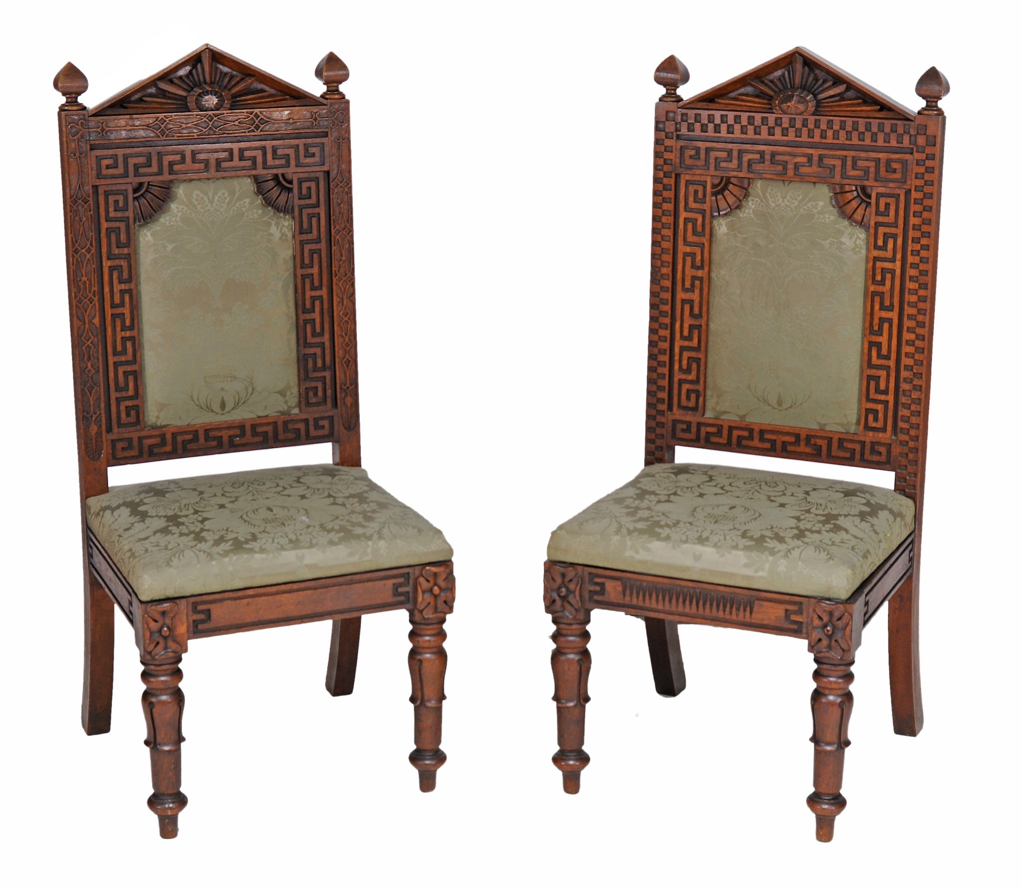 A near pair of early Victorian carved oak and upholstered side chairs  A near pair of early
