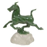 Lyle Sopel (Canadian, b. 1952), a green nephrite carving of a Chinese horse,   on a rock crystal