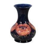 Big Poppy, a Moorcroft baluster vase,   1920s, on a deep blue ground, green painted signature and