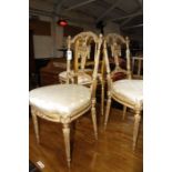 A pair of 19th century French giltwood salon chairs and another single giltwood chair.