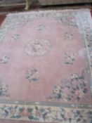 A Chinese cut pile pink ground carpet, approximately 8ft x 10ft