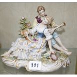 A Naples figure group of courting couple, with underglaze blue mark to base, 14.5cm high approx.