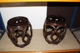 A pair of 20th Century Chinese hardwood stools, barrel shaped, 46cm high