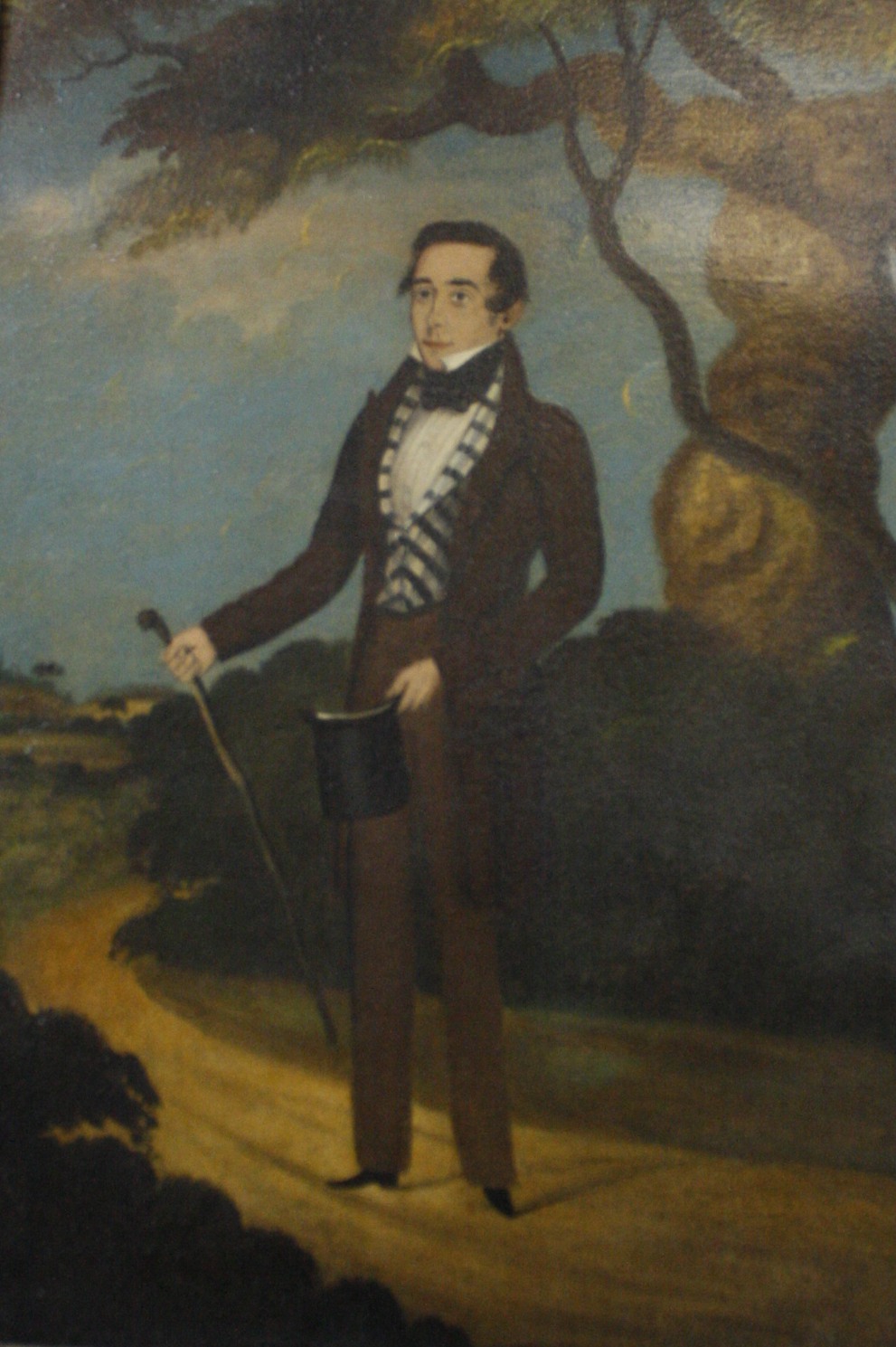 English Naive School A portrait of a gentleman, full length  Oil on board Unsigned  34.5cm x 23.5cm