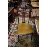 A set of four Edwardian mahogany dining chairs with pierced splats to include one armchair   Best