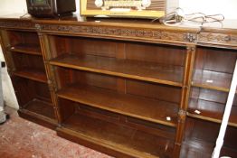 A George III style mahogany dwarf breakfront bookcase, with blind fret freeze and twin columns