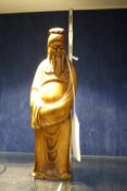 A Chinese boxwood figure of a standing sage, wearing a long robe, 23cm high