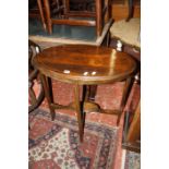 Two Edwardian chairs with floral inlay, an oval Edwardian side table, an Edwardian music cabinet