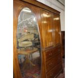 An Edwardian mahogany and inlaid bedroom suite to include a compactum, dressing table with two short