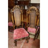 A set of eight Charles II style oak and cane high back dining chairs to include two armchairs,