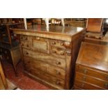 A Georgian chest of drawers with an unusual configuration of small drawers over three long