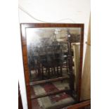 An early Victorian mahogany cheval mirror, with a rectangular frame on turned supports