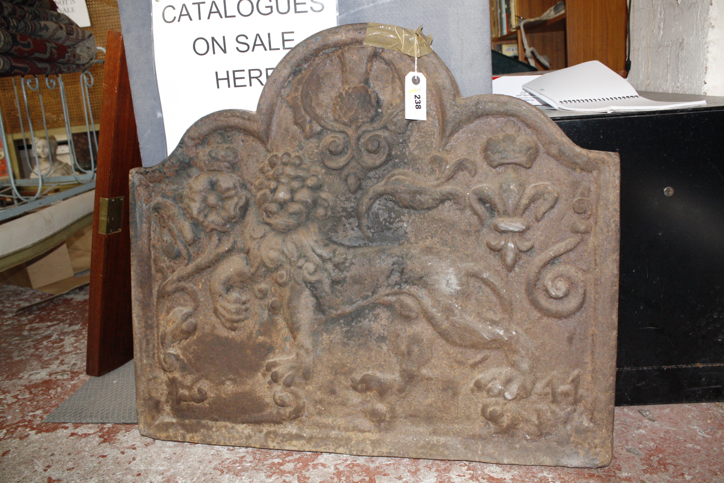 A Victorian cast iron fireback centred by a lion with 69cm high, 79cm wide   Best Bid