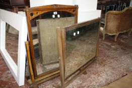 A Victorian mahogany and ebonised swing frame mirror 83cm high, 62cm wide, together with a further