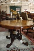 A Victorian walnut tilt top breakfast table on four column support 109cm diameter