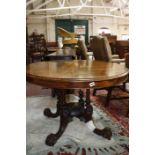 A Victorian walnut tilt top breakfast table on four column support 109cm diameter