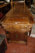 A Chinese hardwood side cabinet in 18th Century style, 77cm wide