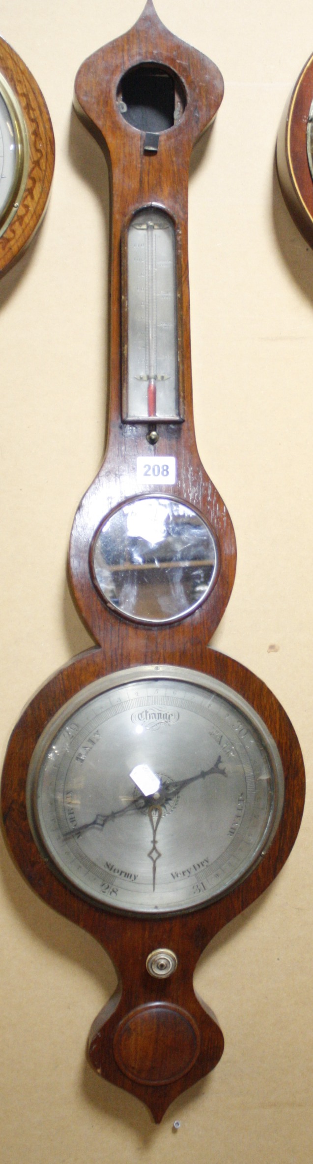 A 20th Century wheel barometer, 96cm long   Best Bid