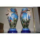 A pair of modern Majolica vases, baluster shaped, blue ground, decorated with relief maidens and