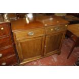 A 19th Century mahogany side cabinet with two drawers and a cupboard 102cm wide